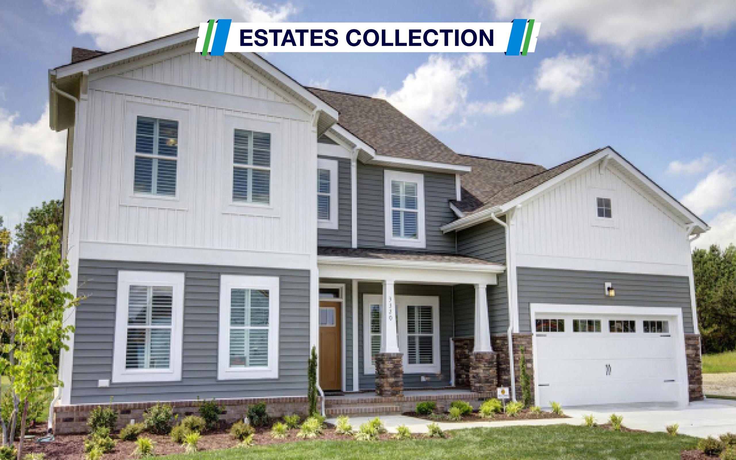 Image of the Milan Model - The Estates Collection. View of the front of this two story home. Exterior includes stone on the bottom, grey and white siding with white trim. Show the front porch , front door, two car garage and nine windows.
