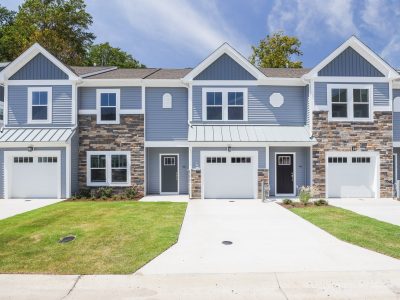 Two story townhome blue siding-front view